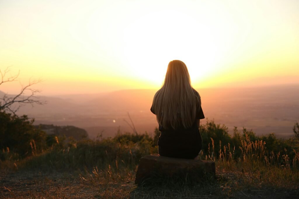 disconnected woman sitting in natural sunlight