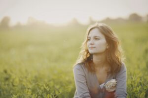 woman reflecting about pain and its cause