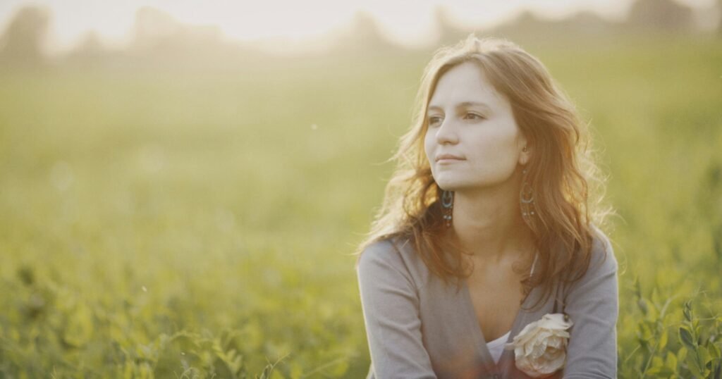 woman reflecting about pain and its cause