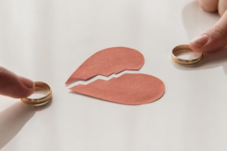 high-angle-hands-touching-wedding-rings