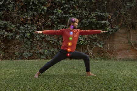 man-maintaining-asana-while-chakra-points-are-aligned